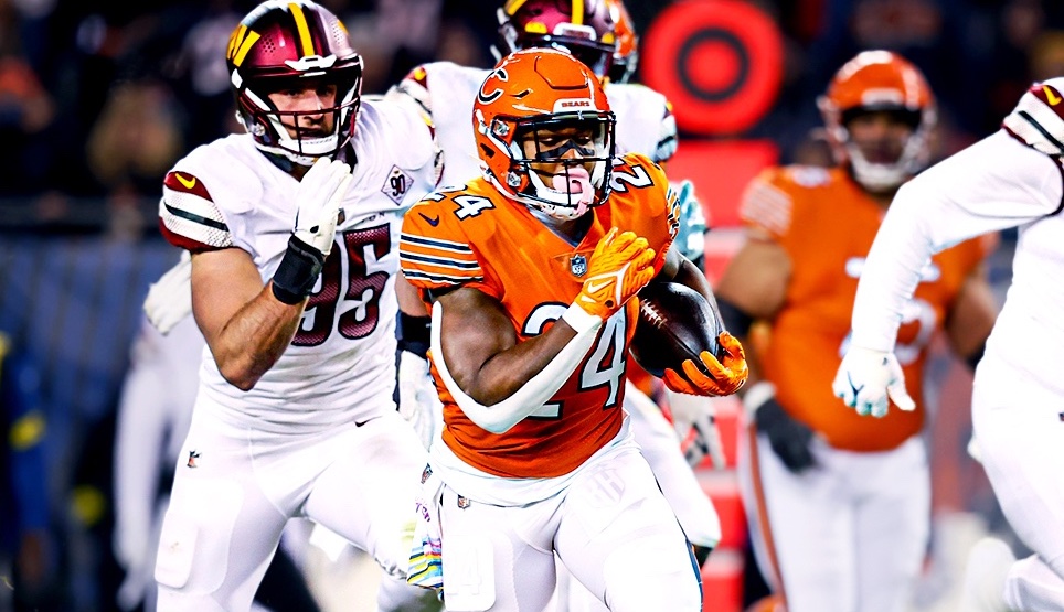 Chicago Bears running back Khalil Herbert carries the ball against the Washington Commanders.